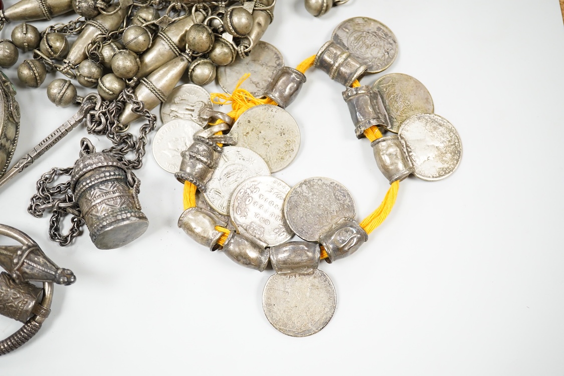 A collection of Bedouin white metal, gilt metal, lapis lazuli mounted jewellery, etc. from Oman